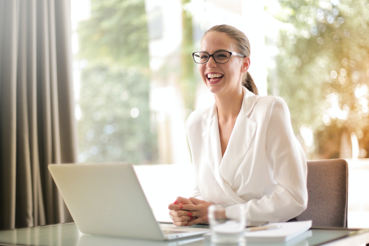 laughing-businesswoman-working-in-office-with-laptop-3756679_105.jpg